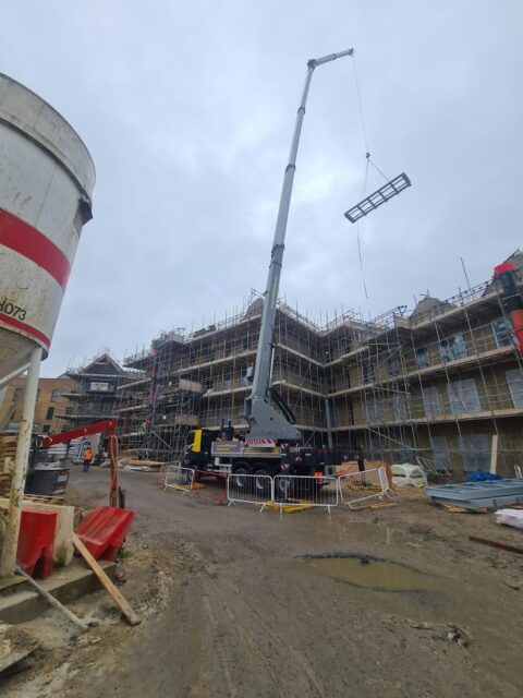 Total lifting services crane moving an object
